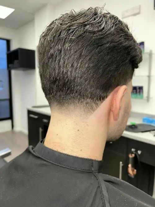 Side profile of a sharp skin fade and beard trim at Goodfellas Barbers Leighton Buzzard